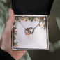 Christmas Background 004 - Interlocking Hearts Necklace