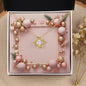 Christmas Background 038 - 18K Yellow Gold Finish Love Knot Necklace