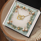 Christmas Background 001 - 18K Yellow Gold Finish Interlocking Hearts Necklace